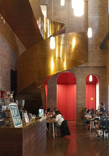restaurant with a copper circle staircase